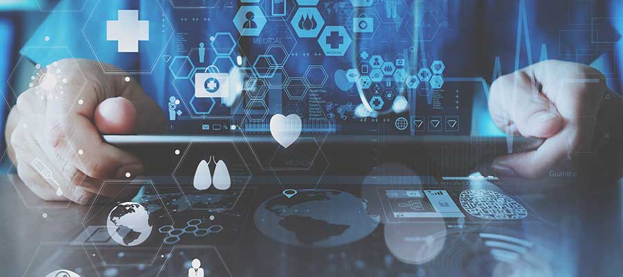 Artificial Intelligence can support health care leaders, but it’s not a complete solution, expert says. A clinician holding a tablet using artificial intelligence to evaluate medical data.