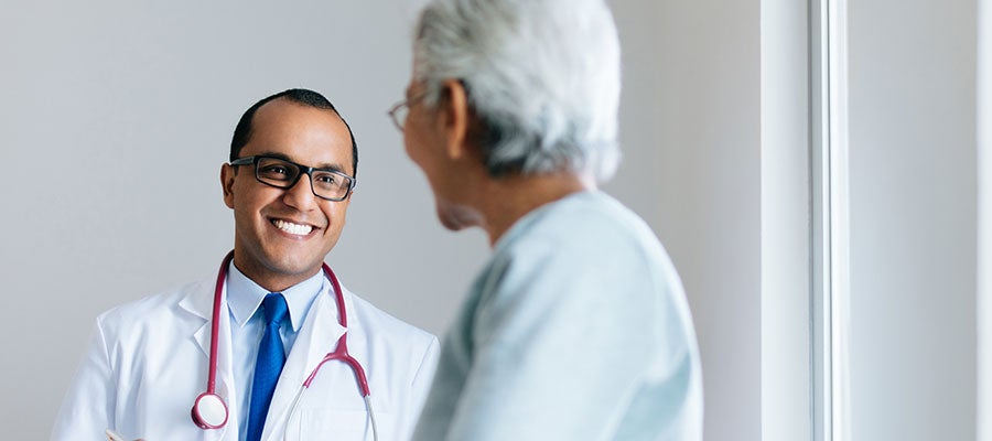 doctor speaking to older female patient