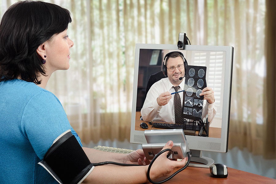 Patient and clinician reviewing health information by telehealth