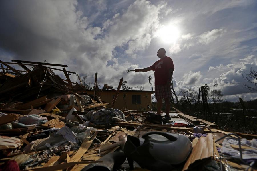 Man standing in rubble.